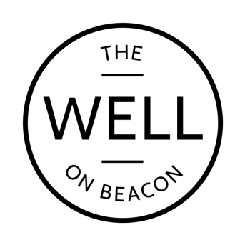 Black white circular logo of The Well on Beacon